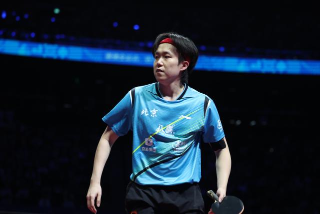 (251120) -- MACAO, Nov. 20, 2025 (Xinhua) -- Wang Chuqin of Beijing reacts in the match against Fan Zhendong of Shanghai during the men's team final of table tennis between Beijing and Shanghai at China's 15th National Games in Macao, south China, Nov. 20, 2025. (Xinhua/Chen Bin)
