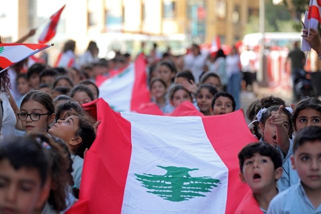 (251120) -- BEIRUT, Nov. 20, 2025 (Xinhua) -- Students participate in a celebration event for Lebanon's upcoming Independence Day in downtown Beirut, Lebanon, Nov. 20, 2025. Lebanon's Independence Day falls on Nov. 22. (Xinhua/Bilal Jawich)