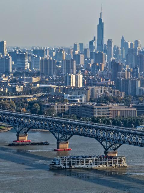 (251121) -- NANJING, Nov. 21, 2025 (Xinhua) -- A drone photo shows vessels sailing under the Nanjing Yangtze River Bridge in Nanjing, east China's Jiangsu Province, Nov. 18, 2025.
  As a province with both the Yangtze River and Beijing-Hangzhou Grand Canal running through, water transportation is key to the development of Jiangsu Province.
  In recent years, Jiangsu has scaled up efforts to build a well-connected inland waterway network and improve the water conservancy system, coupled with its green development endeavors in river basins and seaside areas. (Xinhua/Li Bo)