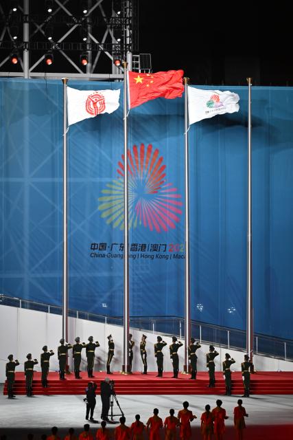 (251121) -- SHENZHEN, Nov. 21, 2025 (Xinhua) -- Flags are raised during the closing ceremony of China's 15th National Games in Shenzhen, south China's Guangdong Province, Nov. 21, 2025. (Xinhua/Li Zhipeng)