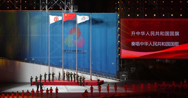 (251121) -- SHENZHEN, Nov. 21, 2025 (Xinhua) -- Flags are raised during the closing ceremony of China's 15th National Games in Shenzhen, south China's Guangdong Province, Nov. 21, 2025. (Xinhua/Chen Sihan)