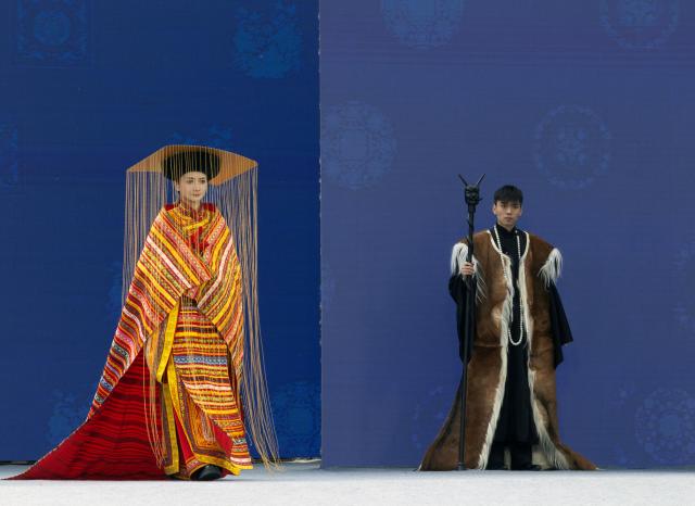 (251121) -- WENCHUAN, Nov. 21, 2025 (Xinhua) -- Models present creations at a fashion show held during an event celebrating the Qiang New Year in Wenchuan County, Aba Tibetan and Qiang Autonomous Prefecture, southwest China's Sichuan Province, Nov. 20, 2025. An event celebrating the Qiang New Year was held here from Wednesday to Thursday, featuring a series of activities. (Photo by Lan Hongguang/Xinhua)