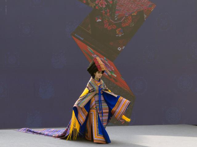 (251121) -- WENCHUAN, Nov. 21, 2025 (Xinhua) -- A model presents creations at a fashion show held during an event celebrating the Qiang New Year in Wenchuan County, Aba Tibetan and Qiang Autonomous Prefecture, southwest China's Sichuan Province, Nov. 20, 2025. An event celebrating the Qiang New Year was held here from Wednesday to Thursday, featuring a series of activities. (Photo by Lan Hongguang/Xinhua)