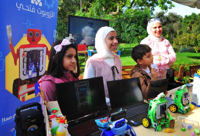 (251121) -- DAMASCUS, Nov. 21, 2025 (Xinhua) -- Children take part in a World Children's Day activity in Damascus, Syria, Nov. 20, 2025. The event featured storytelling, robot games, drawing, music, and other activities aimed at raising children's awareness of their rights. (Photo by Ammar Safarjalani/Xinhua)