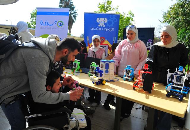 (251121) -- DAMASCUS, Nov. 21, 2025 (Xinhua) -- Children take part in a World Children's Day activity in Damascus, Syria, Nov. 20, 2025. The event featured storytelling, robot games, drawing, music, and other activities aimed at raising children's awareness of their rights. (Photo by Ammar Safarjalani/Xinhua)