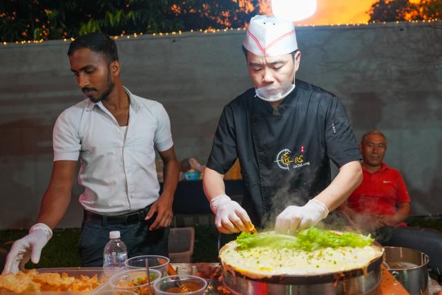 (251122) -- COLOMBO, Nov. 22, 2025 (Xinhua) -- People prepare Chinese food during the 2nd Chinese Food Carnival and China-Sri Lanka Cultural Performance in Colombo, Sri Lanka, Nov. 20, 2025. The event was held here from Thursday to Friday, helping enhance cultural links between two countries. 
   During the event, teams from China, Sri Lanka and other countries also presented performances featuring traditional dances, Chinese martial arts and other shows. (Photo by Thilina Kaluthotage/Xinhua)