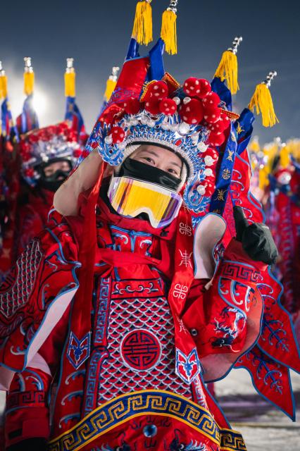 (251122) -- JILIN, Nov. 22, 2025 (Xinhua) -- A skier dressed up in Peking Opera costumes poses before a themed skiing show at the Lake Songhua Resort of Jilin City, northeast China's Jilin Province on Nov. 21, 2025. More than 260 skiers dressed up in Peking Opera costumes ski 1000m together to celebrate the new ski season. (Xinhua/Xu Chang)