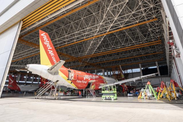(251122) -- HAIKOU, Nov. 22, 2025 (Xinhua) -- Staff members of the Grand China Aviation Maintenance Co., Ltd. under the HNA Technic perform maintenance on an aircraft at the Hainan Free Trade Port (FTP) One-Stop Aircraft Maintenance Base in Haikou, south China's Hainan Province, on Nov. 21, 2025. The Hainan Free Trade Port (FTP) One-Stop Aircraft Maintenance Base, which started operation in 2022, has performed maintenance service on more than 2,400 aircraft, completed full-body painting for over 280 aircraft, and repaired about 60,000 aircraft components as of the end of October this year.
   The maintenance base has drawn global clients like Qatar Airways, Royal Air Philippines and Iberia.
   Under the Hainan FTP's favorable regulations, aircraft entering the region for maintenance are exempt from paying security deposits, and parts imported for repair benefit from a bonded status. The policy support is expected to be amplified following the FTP's official launch of island-wide independent customs operations on Dec. 18. (Xinhua/Zhang Liyun)