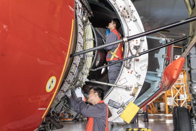 (251122) -- HAIKOU, Nov. 22, 2025 (Xinhua) -- Staff members of the Grand China Aviation Maintenance Co., Ltd. under the HNA Technic perform maintenance on an aircraft at the Hainan Free Trade Port (FTP) One-Stop Aircraft Maintenance Base in Haikou, south China's Hainan Province, on Nov. 21, 2025. The Hainan Free Trade Port (FTP) One-Stop Aircraft Maintenance Base, which started operation in 2022, has performed maintenance service on more than 2,400 aircraft, completed full-body painting for over 280 aircraft, and repaired about 60,000 aircraft components as of the end of October this year.
   The maintenance base has drawn global clients like Qatar Airways, Royal Air Philippines and Iberia.
   Under the Hainan FTP's favorable regulations, aircraft entering the region for maintenance are exempt from paying security deposits, and parts imported for repair benefit from a bonded status. The policy support is expected to be amplified following the FTP's official launch of island-wide independent customs operations on Dec. 18. (Xinhua/Zhang Liyun)