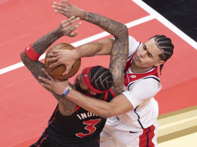 (251122) -- TORONTO, Nov. 22, 2025 (Xinhua) -- Brandon Ingram (L) of Toronto Raptors vies with Kyshawn George of Washington Wizards during the 2025-2026 NBA Cup group match between Toronto Raptors and Washington Wizards in Toronto, Canada, Nov. 21, 2025. (Photo by Zou Zheng/Xinhua)