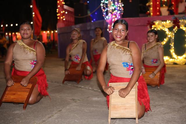 (251122) -- PUERTO CABEZAS, Nov. 22, 2025 (Xinhua) -- This photo taken on Nov. 19, 2025 shows people performing a local dance in Puerto Cabezas, in North Caribbean Coast Autonomous Region, Nicaragua. Puerto Cabezas, located on Nicaragua's eastern Caribbean coast, serves as the capital of the North Caribbean Coast Autonomous Region (RACCN). This distinctive port city features a hot, humid climate, scenic landscapes, and abundant natural resources. (Xinhua/Li Mengxin)