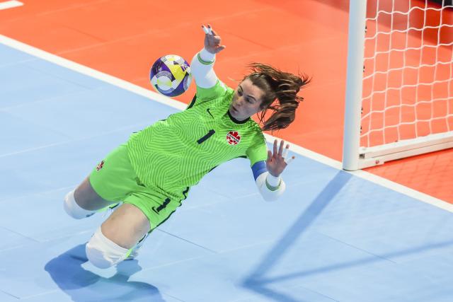 (251122) -- PASIG CITY, Nov. 22, 2025 (Xinhua) -- Goalkeeper Lea Palacio-Tellier of Canada makes a save during the match between Colombia and Canada at the FIFA Futsal Women's World Cup 2025 in Pasig City, the Philippines, Nov. 22, 2025. (Xinhua/Rouelle Umali)