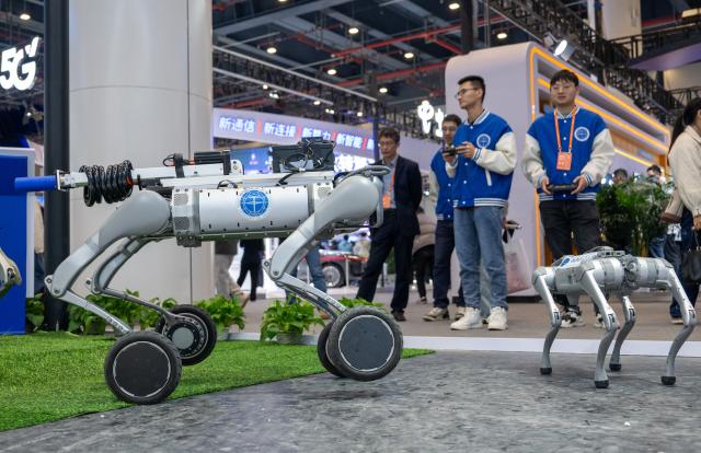 (251122) -- WUHAN, Nov. 22, 2025 (Xinhua) -- A robotic dog for on-site survey is seen during the 2025 China 5G + Industrial Internet Conference in Wuhan, central China's Hubei Province, Nov. 21, 2025. The conference kicked off here on Friday and will run through Sunday. (Xinhua/Du Zixuan)