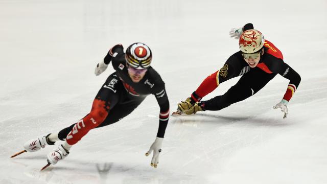 (251123) -- GDANSK, Nov. 23, 2025 (Xinhua) -- William Dandjinou of Canada (L) and Lin Xiaojun of China compete during the men's 500m final A at the ISU Short Track World Tour #3 speed skating event in Gdansk, Poland, Nov. 22, 2025. (Xinhua/Gao Jing)