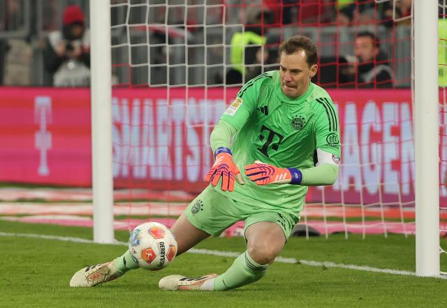 (251123) -- MUNICH, Nov. 23, 2025 (Xinhua) -- Bayern Munich's goalkeeper Manuel Neuer makes a save during the German first division Bundesliga football match between Bayern Munich and SC Freiburg in Munich, Germany, Nov. 22, 2025. (Photo by Philippe Ruiz/Xinhua)