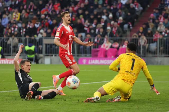 (251123) -- MUNICH, Nov. 23, 2025 (Xinhua) -- Noah Atubolu (R), goalkeeper of SC Freiburg makes a save during the German first division Bundesliga football match between Bayern Munich and SC Freiburg in Munich, Germany, Nov. 22, 2025. (Photo by Philippe Ruiz/Xinhua)