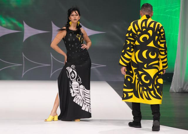 (251123) -- VANCOUVER, Nov. 23, 2025 (Xinhua) -- Models present creations by Ay Lelum Sparrow during the closing night of Vancouver Indigenous Fashion Week 2025 in Vancouver, British Columbia, Canada, Nov. 22, 2025.
  The show highlighted the spirit of Canada's West Coast, marking the conclusion of the week-long celebration of indigenous culture and creativity. (Photo by Liang Sen/ Xinhua)