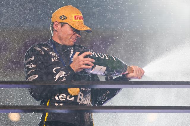 (251123) -- LAS VEGAS, Nov. 23, 2025 (Xinhua) -- Red Bull's Dutch driver Max Verstappenn celebrates his victory on the podium during the awarding ceremony for the 2025 Formula One U.S. Grand Prix at Las Vegas Circuit, in Las Vegas, the United States, Nov. 22, 2025. (Photo by Qian Jun/Xinhua)