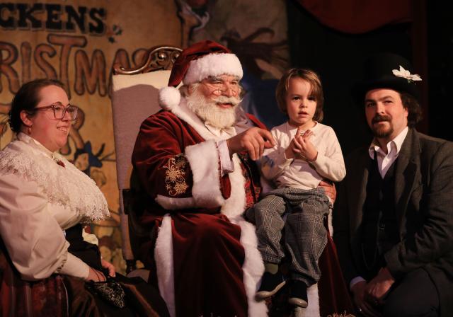 (251123) -- SAN FRANCISCO, Nov. 23, 2025 (Xinhua) -- Actors dressed as Santa Claus (2nd L) and Mrs. Claus (1st L) pose for photos with a man and his daughter during the Great Dickens Christmas Fair in San Francisco, the United States, Nov. 22, 2025.
  The Great Dickens Christmas Fair, which was first held in 1970, opened here on Saturday. Featuring an immersive adventure into Victorian era, the fair transports visitors in a world created by British novelist Charles Dickens in a festive mood. (Photo by Liu Yilin/Xinhua)
