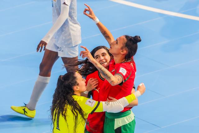 (251123) -- PASIG CITY, Nov. 23, 2025 (Xinhua) -- Players of Portugal celebrate after scoring a goal during the Group C match between Portugal and Tanzania at the FIFA Futsal Women's World Cup 2025 in Pasig City, the Philippines, Nov. 23, 2025. (Xinhua/Rouelle Umali)