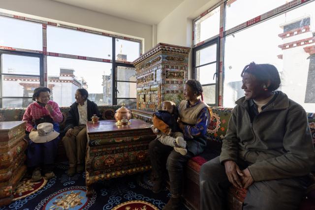 (251123) -- XIGAZE, Nov. 23, 2025 (Xinhua) -- A villager (2nd L) hosts neighbors in her new house in Gyabug Village of Dingri County, Xigaze City, southwest China's Xizang Autonomous Region, Oct. 24, 2025. In early January, a 6.8-magnitude earthquake struck Dingri County in the city of Xigaze, leveling thousands of houses. 
   Ten months after the earthquake, more than 32,500 destroyed or damaged houses have been restored and handed over to affected residents, according to the authorities of Xigaze City. 
   In less than three days after the earthquake, Xizang rolled out a post-disaster reconstruction plan and kicked off the preliminary work, which included field survey, housing design and debris clearance.
   The restoration work covered 486 villages in seven counties, resulting in the reconstruction of more than 22,000 houses and the reinforcement of an additional 10,500 homes. The first batch of quake-affected residents have moved into new homes in August. (Xinhua/Jiang Fan)