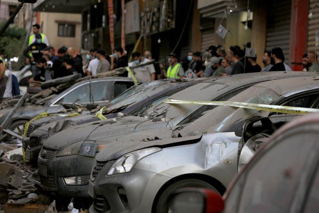 (251124) -- BEIRUT, Nov. 24, 2025 (Xinhua) -- This photo taken on Nov. 23, 2025 shows the damaged vehicles at the scene of an Israeli airstrike in Haret Hreik, Beirut's southern suburbs, Lebanon. At least five people were killed and 25 others injured on Sunday in an Israeli airstrike targeting a residential apartment in Haret Hreik, the Lebanese Health Ministry reported. (Xinhua/Bilal Jawich)