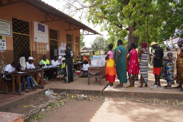 (251124) -- BISSAU, Nov. 24, 2025 (Xinhua) -- People wait in line to vote at a polling station in Mansoa, Oio Region, Guinea-Bissau, Nov. 23, 2025. Guinea-Bissau on Sunday launched its presidential and legislative elections, with more than 960,000 registered voters set to choose a new head of state and 102 members of the National People's Assembly. (Xinhua/Si Yuan)