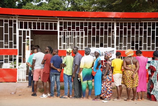 (251124) -- BISSAU, Nov. 24, 2025 (Xinhua) -- People wait in line to vote at a polling station in Bissau, Guinea-Bissau, Nov. 23, 2025. Guinea-Bissau on Sunday launched its presidential and legislative elections, with more than 960,000 registered voters set to choose a new head of state and 102 members of the National People's Assembly. (Xinhua/Si Yuan)