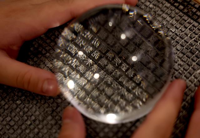 (251124) -- BEIJING, Nov. 24, 2025 (Xinhua) -- A visitor views fine steel Chinese characters for Chinese typewriters at the exhibition "Hanzi of the West, Letters of the East" in London, Britain, Nov. 22, 2025.
  A special event for an exhibition in London tracing the evolution of Chinese characters and their role in cultural exchange between China and the West kicked off Saturday at a gallery in London.
  The event combined historical displays with contemporary design as well as discussions between invited scholars and guests. The exhibition, lasting from Nov. 19 to 23, features more than 100 original works inspired by hanzi, or Chinese characters. (Xinhua/Li Ying)