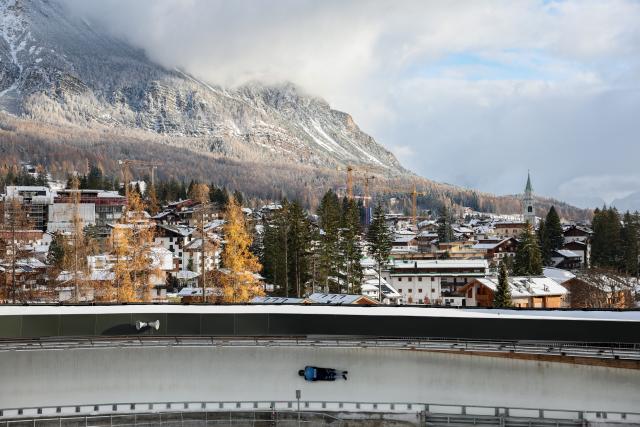 (251124) -- BEIJING, Nov. 24, 2025 (Xinhua) -- A forerunner slides on the piste of Cortina Sliding Center in Cortina D'Ampezzo, Italy, Nov. 21, 2025. Located in Italy's northern region of Veneto, Cortina d'Ampezzo is famed for its beauty, ski resort and sporting legacy, beginning with the 1956 Olympic Winter Games and carrying through to Milan-Cortina 2026. (Xinhua/Li Jing)