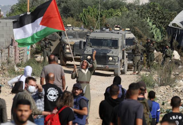 (251124) -- TULKARM, Nov. 24, 2025 (Xinhua) -- Palestinians demonstrate demanding to return to Nur Shams camp, east of Tulkarm city, in the northern West Bank, on Nov. 23, 2025. Dozens of displaced people from Nur Shams camp gathered here to demand return to their homes. (Photo by Nidal Eshtayeh/Xinhua)