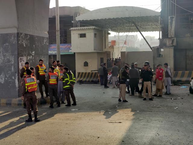 (251124) -- PESHAWAR, Nov. 24, 2025 (Xinhua) -- Security personnel and rescuers gather at the blast site in Peshawar, northwest Pakistan, on Nov. 24, 2025. At least three security personnel were killed and five others injured on Monday morning in an attack at the Federal Constabulary's headquarters in Pakistan's northwest Khyber Pakhtunkhwa provincial capital of Peshawar, police said. (Photo by Umar Qayyum/Xinhua)