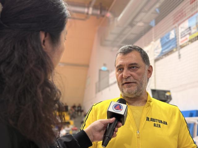 (251124) -- FOT, Nov. 24, 2025 (Xinhua) -- Alex Arutyunjan talks during an interview at the 2025 Hungarian Wushu Championships in Fot, a small town in the Budapest region, Hungary, on Nov. 22, 2025. TO GO WITH "Wushu passion sweeps Budapest at Hungarian Championships" (Xinhua/Chen Hao)