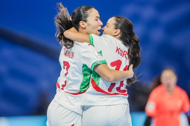 (251124) -- PASIG CITY, Nov. 24, 2025 (Xinhua) -- Players of Morocco celebrate after scoring a goal during the group A match between Morocco and the Philippines at the FIFA Futsal Women's World Cup 2025 in Pasig City, the Philippines, Nov. 24, 2025. (Xinhua/Rouelle Umali)