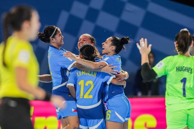 (251124) -- PASIG CITY, Nov. 24, 2025 (Xinhua) -- Players of the Philippines celebrate after scoring a goal during the group A match between Morocco and the Philippines at the FIFA Futsal Women's World Cup 2025 in Pasig City, the Philippines, Nov. 24, 2025. (Xinhua/Rouelle Umali)