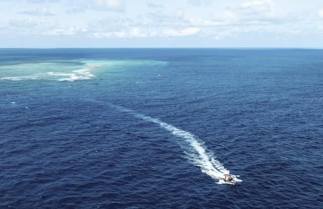 (251124) -- SOUTH CHINA SEA, Nov. 24, 2025 (Xinhua) -- An aerial drone photo shows the China Coast Guard (CCG) conducting law enforcement patrols in the territorial waters of China's Huangyan Dao and surrounding areas on Nov. 14, 2025. (Xinhua/Bei He)