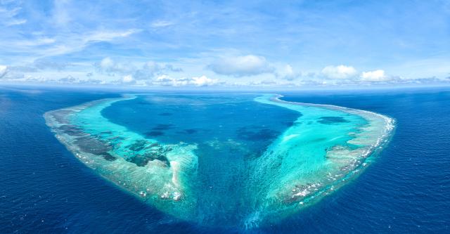 (251125) -- BEIJING, Nov. 25, 2025 (Xinhua) -- An aerial drone photo taken on Nov. 14, 2025 shows a panoramic view of China's Huangyan Dao in the South China Sea. Huangyan Dao is part of China's Zhongsha Qundao with diverse natural ecosystem. (Xinhua/Bei He)