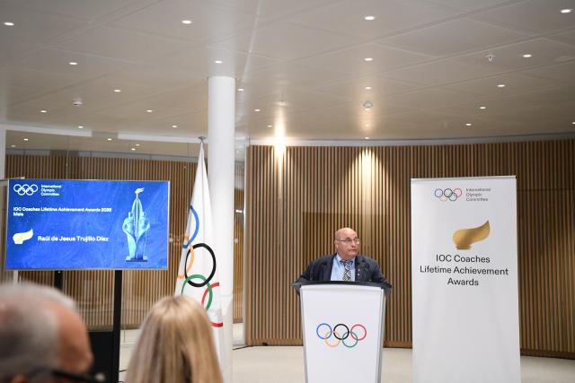(251125) -- LAUSANNE, Nov. 25, 2025 (Xinhua) -- Cuba's wrestling coach Raul de Jesus Trujillo Diaz speaks after being honored the IOC Coaches Lifetime Achievement Award at the Olympic House in Lausanne, Switzerland, Nov. 24, 2025. The International Olympic Committee (IOC) on Monday honored Chinese volleyball coach Lang Ping and Cuban wrestling coach Raul de Jesus Trujillo Diaz with the IOC Coaches Lifetime Achievement Awards. (Xinhua/Lian Yi)