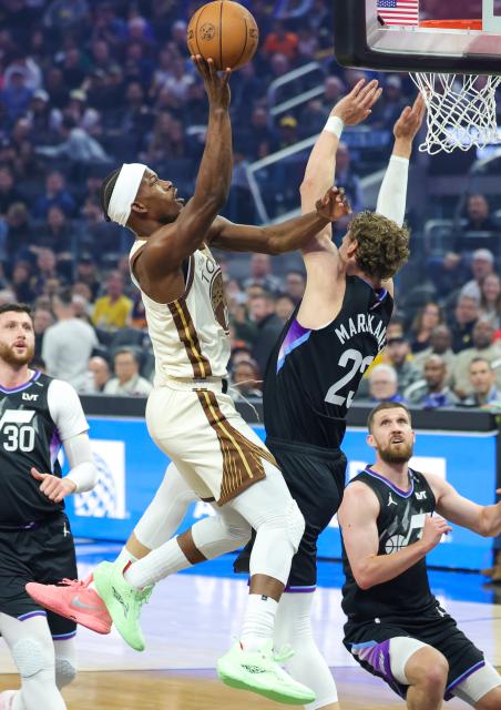 (251125) -- SAN FRANCISCO, Nov. 25, 2025 (Xinhua) -- Jimmy Butler (L) of Golden State Warriors goes for a layup during the 2025-2026 NBA regular season game between Utah Jazz and Golden State Warriors in San Francisco, the United States, Nov. 24, 2025. (Photo by Dong Xudong/Xinhua)