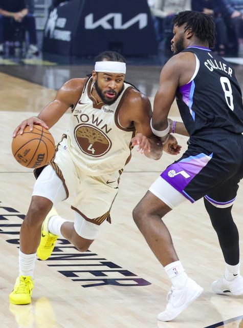 (251125) -- SAN FRANCISCO, Nov. 25, 2025 (Xinhua) -- Moses Moody (L) of Golden State Warriors dribbles the ball during the 2025-2026 NBA regular season game between Utah Jazz and Golden State Warriors in San Francisco, the United States, Nov. 24, 2025. (Photo by Dong Xudong/Xinhua)