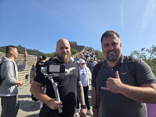(251125) -- BELGRADE, Nov. 25, 2025 (Xinhua) -- This undated photo shows Serbian documentary producer Bosko Kozarski (R) at the Great Wall in Beijing, capital of China. TO GO WITH "Feature: Serbian documentary producer finds inspiration in Beijing's blend of history, modern life" (Xinhua)