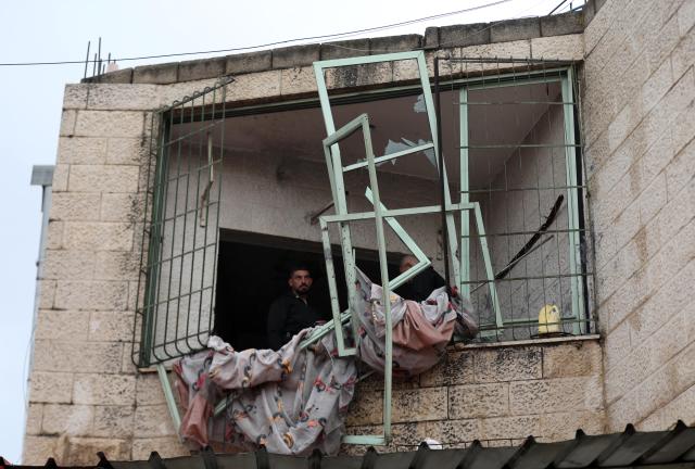 (251125) -- NABLUS, Nov. 25, 2025 (Xinhua) -- This photo taken on Nov. 25, 2025 shows a damaged building following an Israeli military operation in the West Bank city of Nablus. A Palestinian man was killed on Monday evening during an exchange of fire with Israeli forces in the northern West Bank city of Nablus, Palestinian sources said. (Photo by Ayman Nobani/Xinhua)
