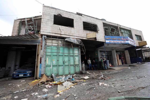 (251125) -- NABLUS, Nov. 25, 2025 (Xinhua) -- This photo taken on Nov. 25, 2025 shows a damaged building following an Israeli military operation in the West Bank city of Nablus. A Palestinian man was killed on Monday evening during an exchange of fire with Israeli forces in the northern West Bank city of Nablus, Palestinian sources said. (Photo by Ayman Nobani/Xinhua)