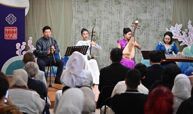 (251125) -- HAWALLI GOVERNORATE, Nov. 25, 2025 (Xinhua) -- Chinese musicians perform at the China Cultural Center in Hawalli Province, Kuwait, on Nov. 24, 2025. The China Cultural Center in Kuwait hosted a Chamber Concert of Chinese Classical Music event under the theme "Traditional Rhythm & New Vibe" as part of its Chinese Culture Series -- Night of Chinese Language. (Photo by Asad/Xinhua)