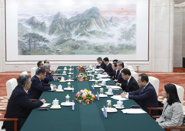 (251125) -- BEIJING, Nov. 25, 2025 (Xinhua) -- Wang Yi, a member of the Political Bureau of the Communist Party of China Central Committee and director of the Office of the Central Commission for Foreign Affairs, meets with Raja Dato' Nushirwan bin Zainal Abidin, director-general of Malaysia's National Security Council, in Beijing, capital of China, Nushirwan is in China to attend the second Bilateral Dialogue between China and Malaysia on the Management of Maritime Issues in the South China Sea. (Xinhua/Wang Ye)