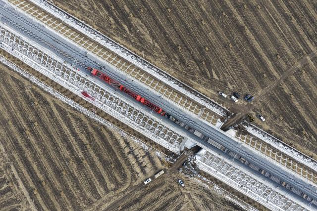 (251125) -- QING'AN, Nov. 25, 2025 (Xinhua) -- An aerial drone photo taken on Nov. 25, 2025 shows a construction site of the Harbin-Yichun high-speed railway in Qing'an County, northeast China's Heilongjiang Province. Track-laying for the Harbin-Yichun high-speed railway completed on Tuesday. The Harbin-Yichun high-speed railway is China's northernmost high-speed railway under construction. (Xinhua/Wang Song)