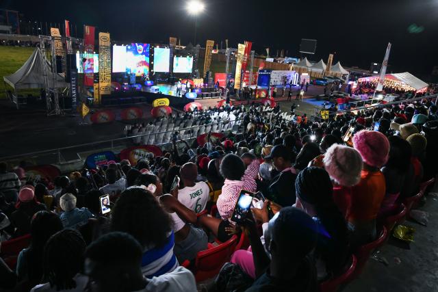 (251125) -- YAOUNDE, Nov. 25, 2025 (Xinhua) -- People watch a nighttime music concert during the Cameroon International Music Festival in Buea, Cameroon, on Nov. 22, 2025. TO GO WITH "Feature: Melody as remedy -- Music festival eases conflict pains in Cameroon's troubled region" (Xinhua/Kepseu)