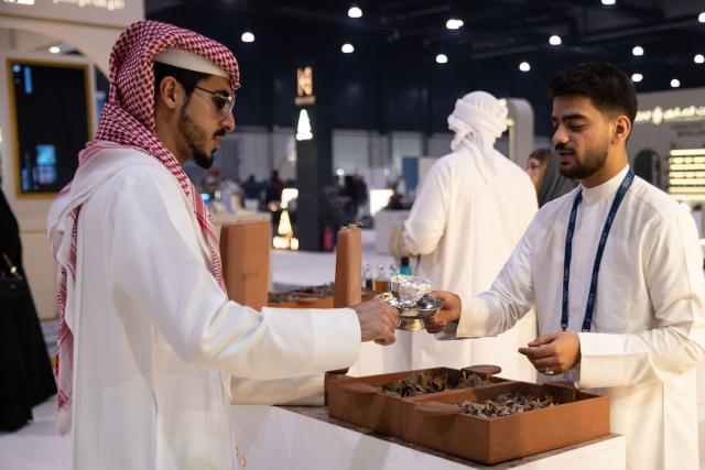 (251125) -- MANAMA, Nov. 25, 2025 (Xinhua) -- An exhibitor showcases Arabian incense at the "Scent Arabia" exhibition in Manama, Bahrain, Nov. 25, 2025. The "Scent Arabia" exhibition opened at Exhibition World Bahrain in Manama, Bahrain on Tuesday, featuring over 100 brands from the Gulf countries and worldwide, including perfumes, home fragrances and Arabian incense. The event is scheduled to run through Nov. 29. (Xinhua/Chen Junqing)