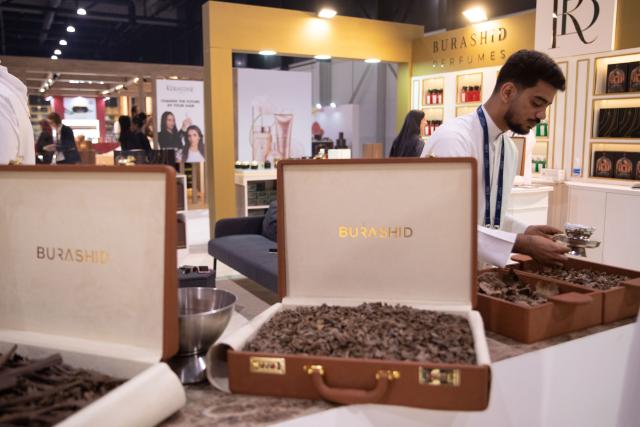 (251125) -- MANAMA, Nov. 25, 2025 (Xinhua) -- An exhibitor showcases Arabian incense at the "Scent Arabia" exhibition in Manama, Bahrain, Nov. 25, 2025. The "Scent Arabia" exhibition opened at Exhibition World Bahrain in Manama, Bahrain on Tuesday, featuring over 100 brands from the Gulf countries and worldwide, including perfumes, home fragrances and Arabian incense. The event is scheduled to run through Nov. 29. (Xinhua/Chen Junqing)