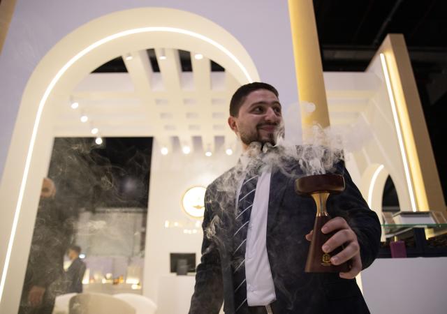 (251125) -- MANAMA, Nov. 25, 2025 (Xinhua) -- An exhibitor showcases Arabian incense at the "Scent Arabia" exhibition in Manama, Bahrain, Nov. 25, 2025. The "Scent Arabia" exhibition opened at Exhibition World Bahrain in Manama, Bahrain on Tuesday, featuring over 100 brands from the Gulf countries and worldwide, including perfumes, home fragrances and Arabian incense. The event is scheduled to run through Nov. 29. (Xinhua/Chen Junqing)